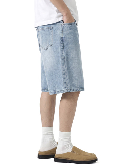 Model wearing 017 men's relaxed denim shorts in Light Blue, side view