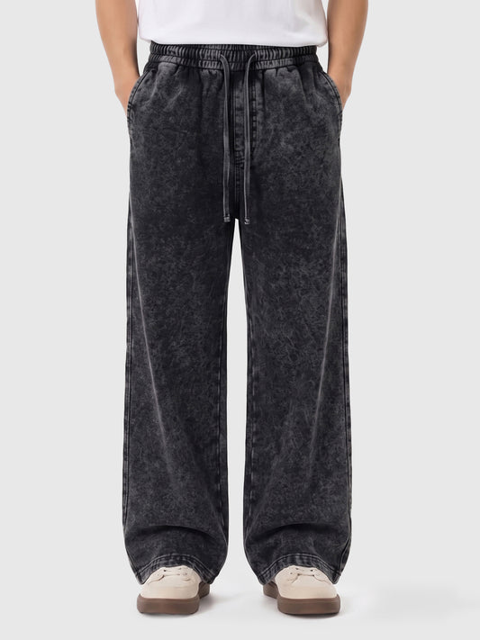 Model wearing A3507 vintage straight-leg sweatpants in Washed Black, front view