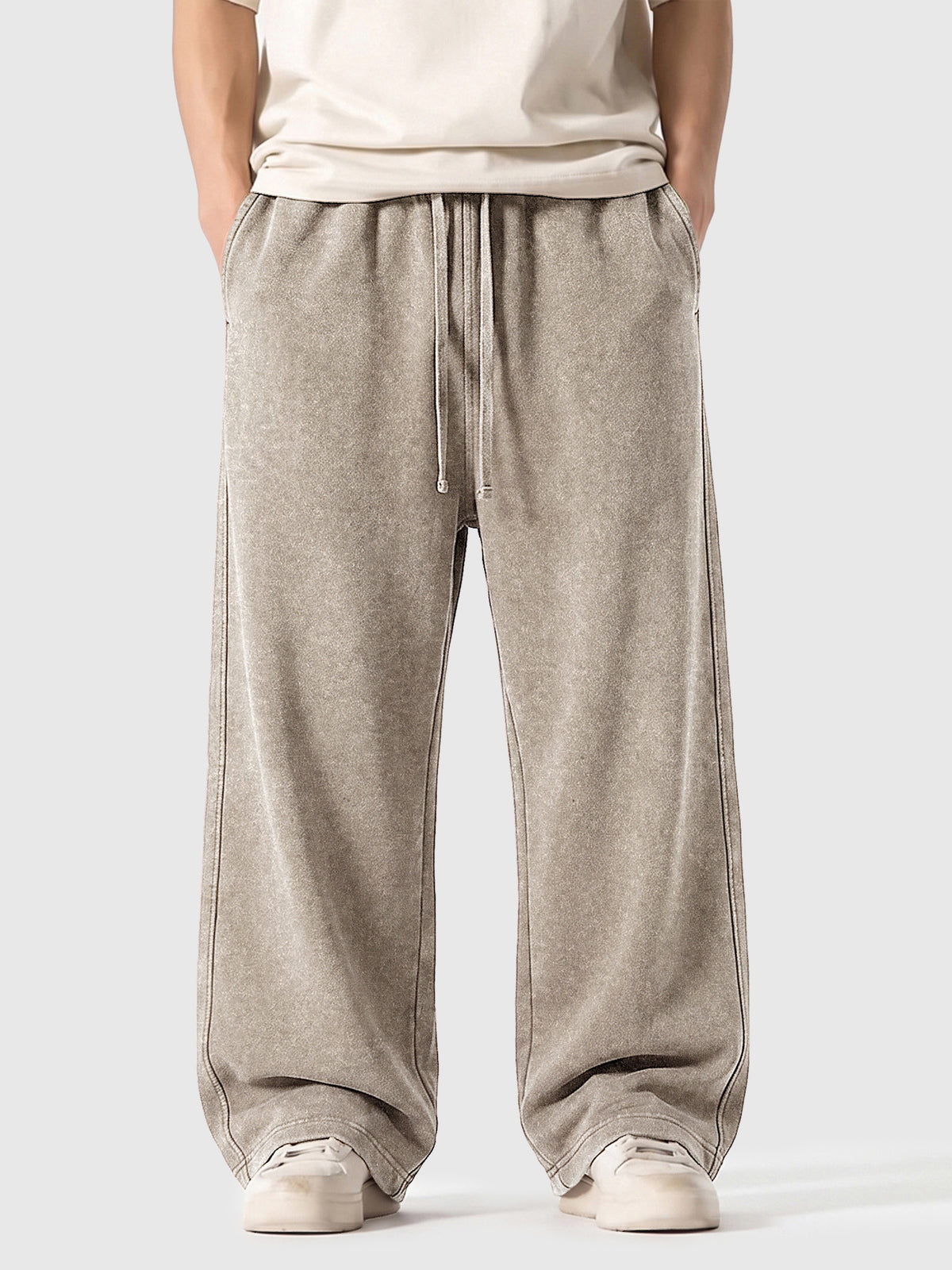 Model wearing A3507 vintage straight-leg sweatpants in Washed Light Brown, front view