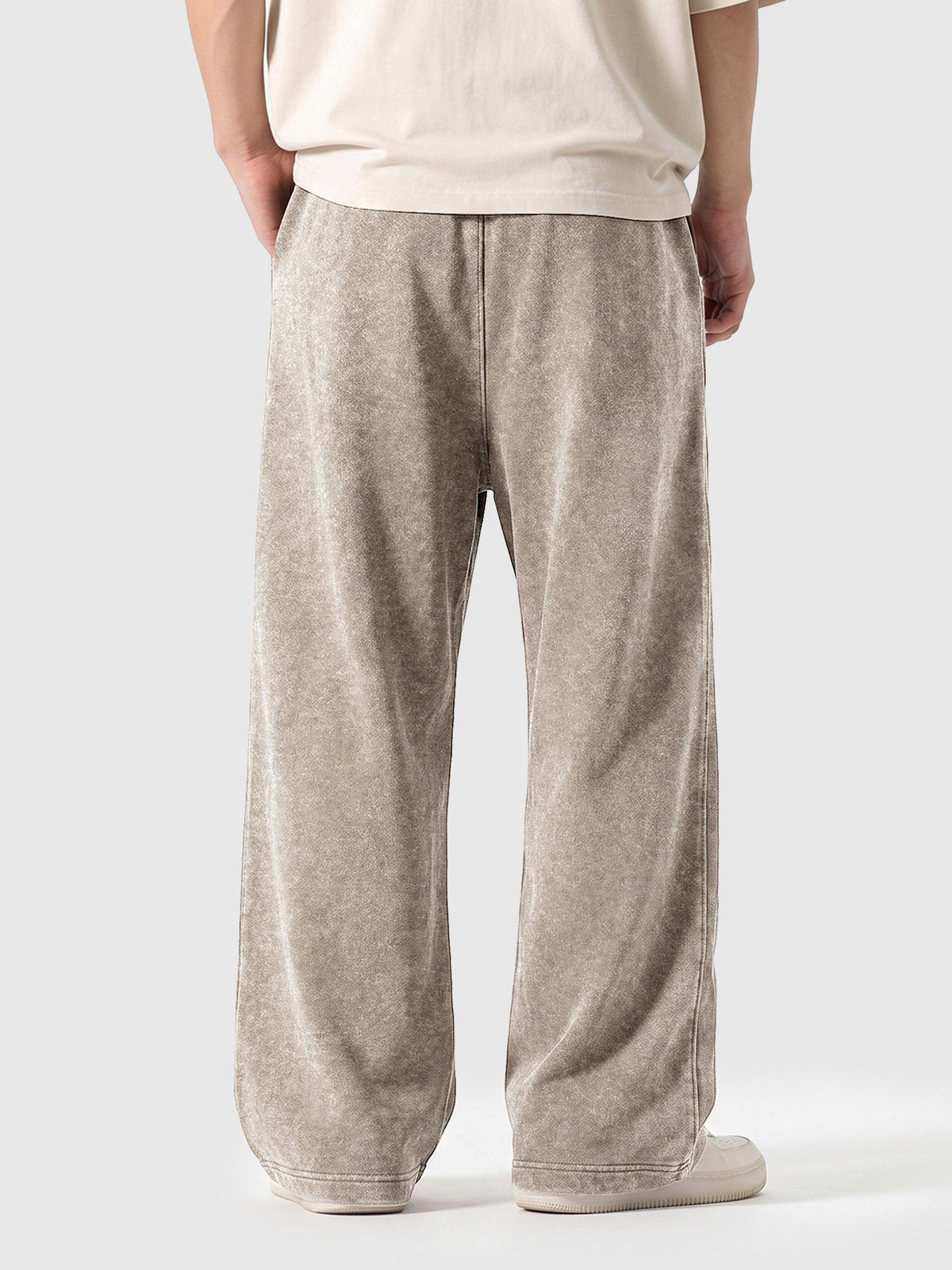 Model wearing A3507 vintage straight-leg sweatpants in Washed Light Brown, back view