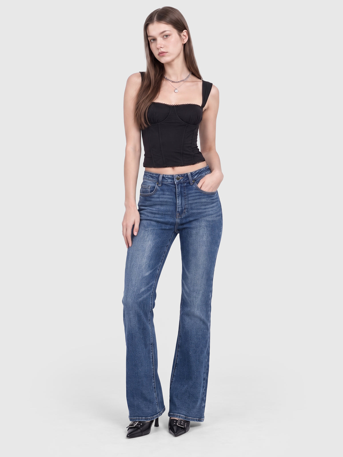 Model wearing B2228 women's flare denim jeans in Blue, front view 1