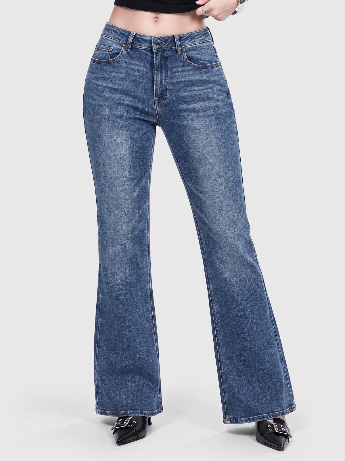 Model wearing B2228 women's flare denim jeans in Blue, front view 2