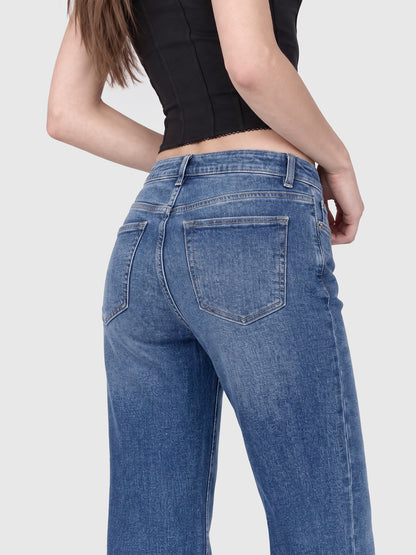 Model wearing B2228 women's flare denim jeans in Blue, fit detail