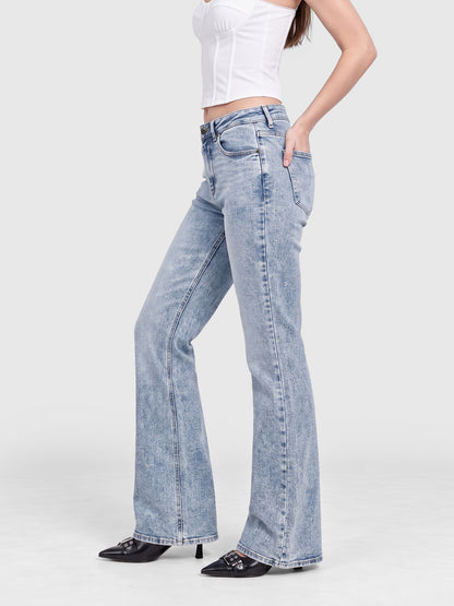 Model wearing B2228 women's flare denim jeans in Light Blue, side view