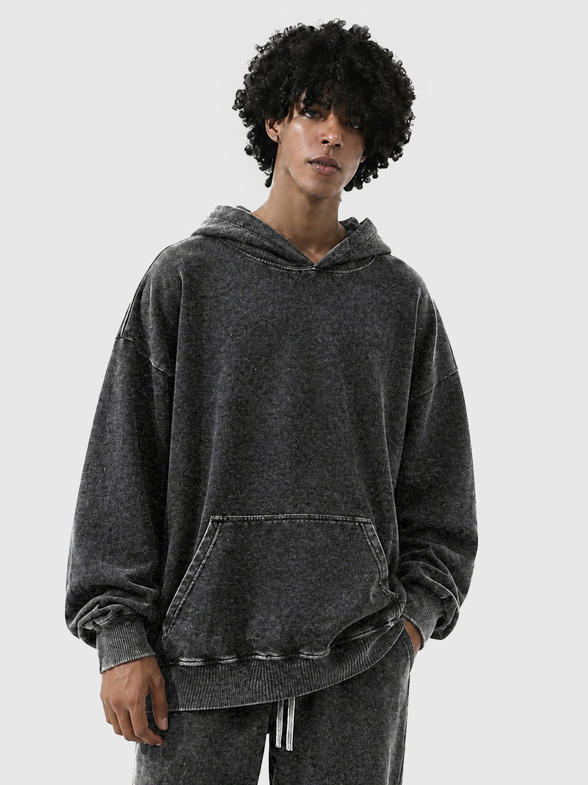 Model wearing B3508 vintage pullover hoodie in Washed Black, front view 2