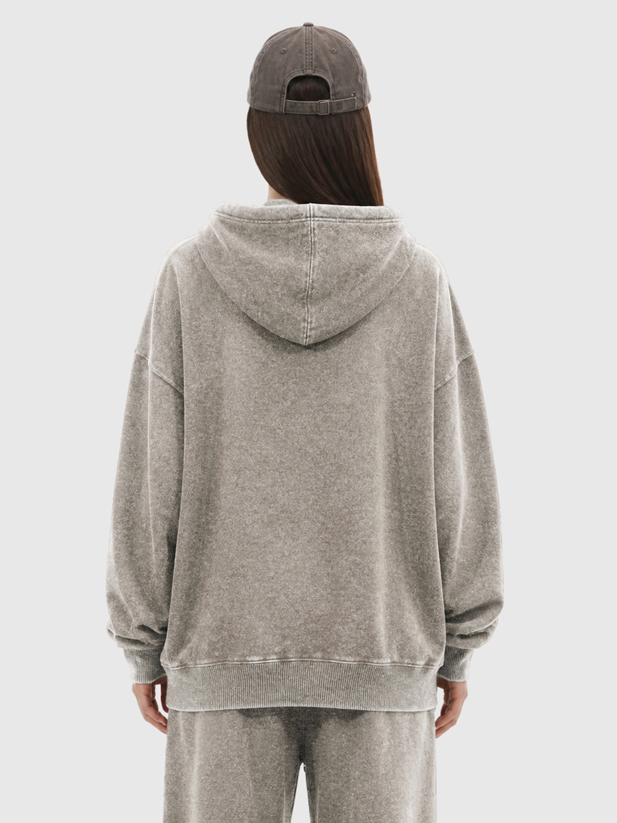 Model wearing B3508 vintage pullover hoodie in Washed Light Brown, back view 1