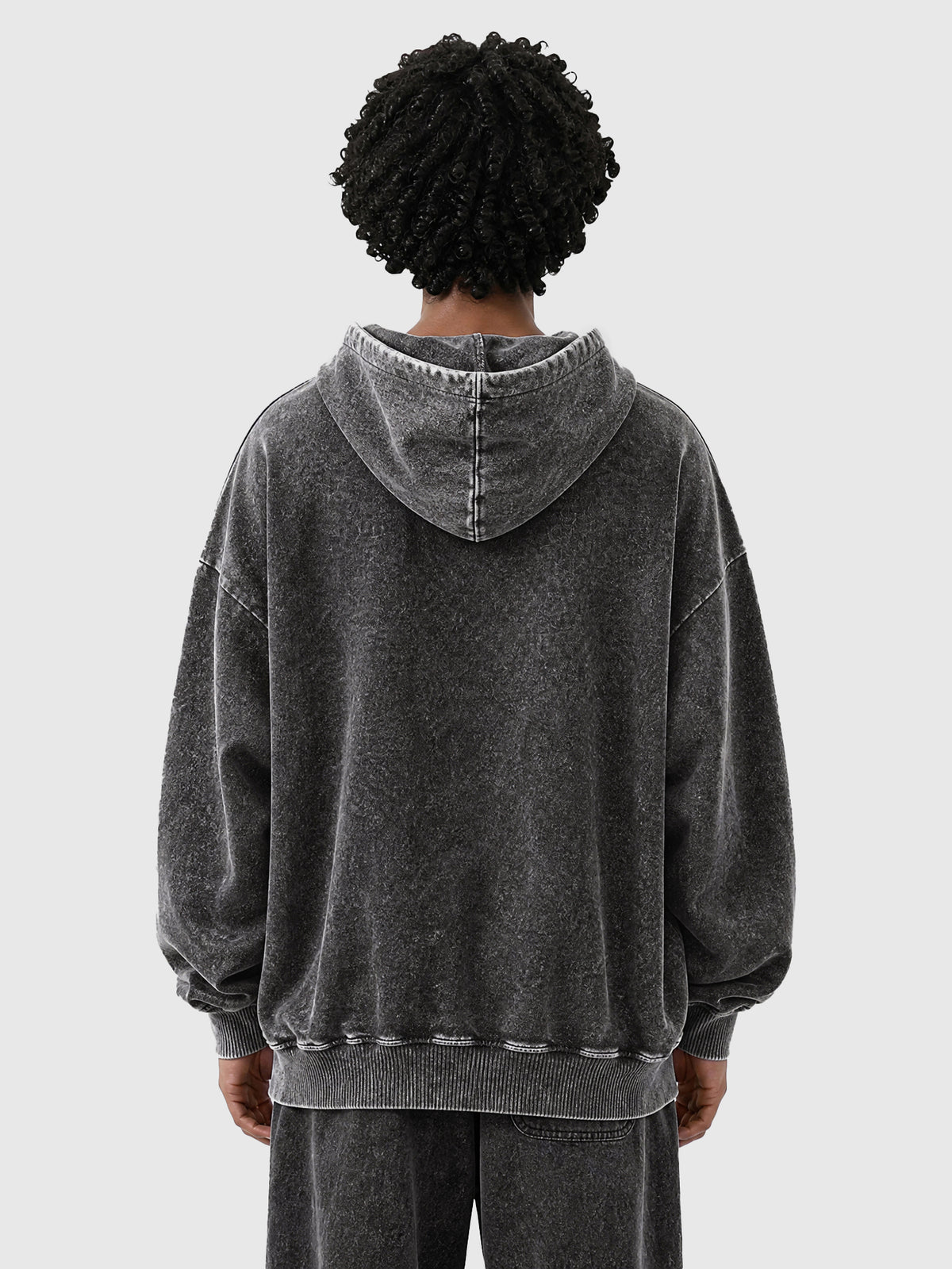 Model wearing B3509 vintage zip-up hoodie in Washed Black, back view