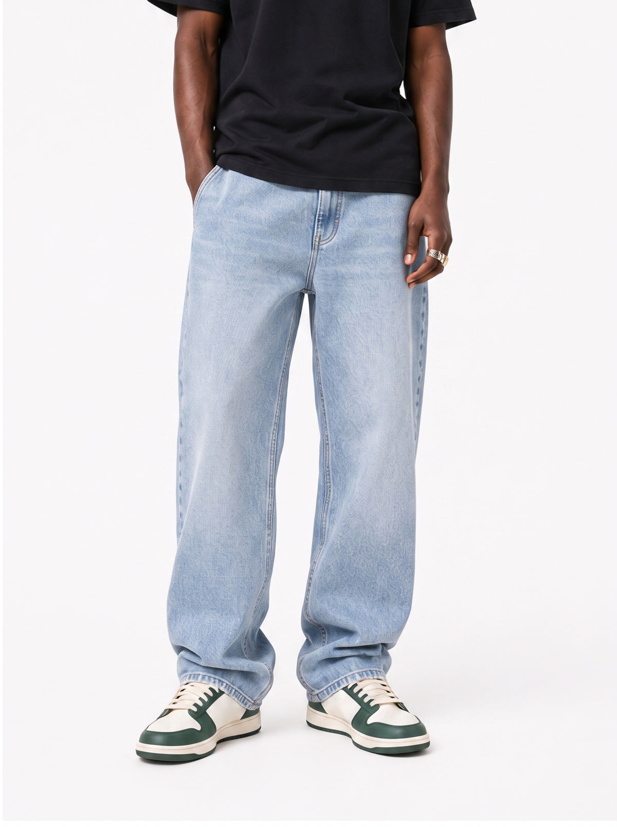 Model wearing B704 men's wide-leg denim jeans in Soft Light Blue, front view 1