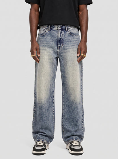 Model wearing B704 men's wide-leg denim jeans in Dusty light Blue, front view