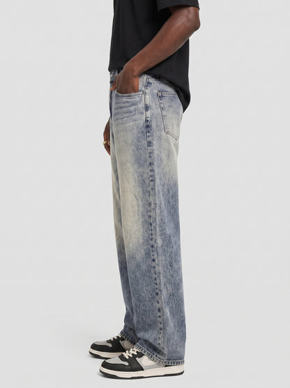 Model wearing B704 men's wide-leg denim jeans in Dusty light Blue, side view