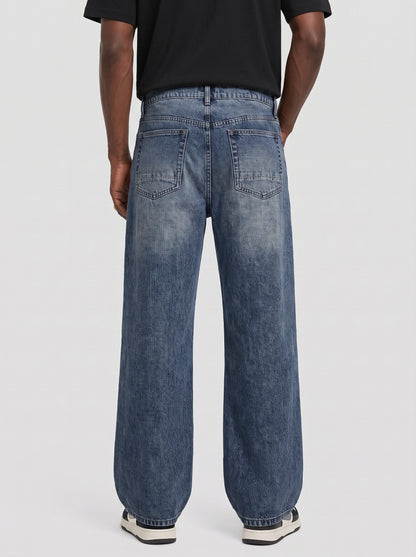 Model wearing B704 men's wide-leg denim jeans in Dark Blue, back view