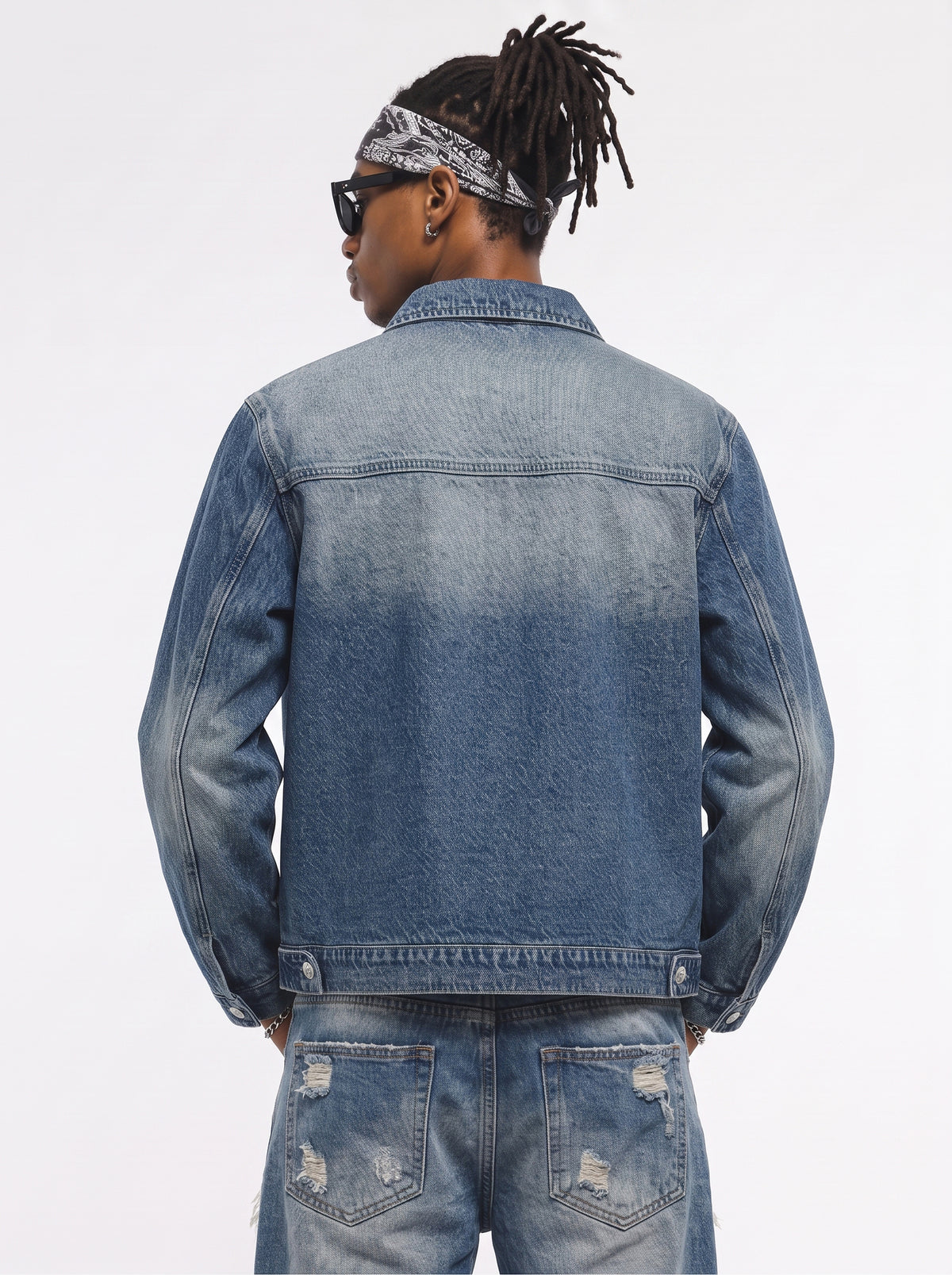 Model wearing B81 denim jacket in Aged Indigo, back view