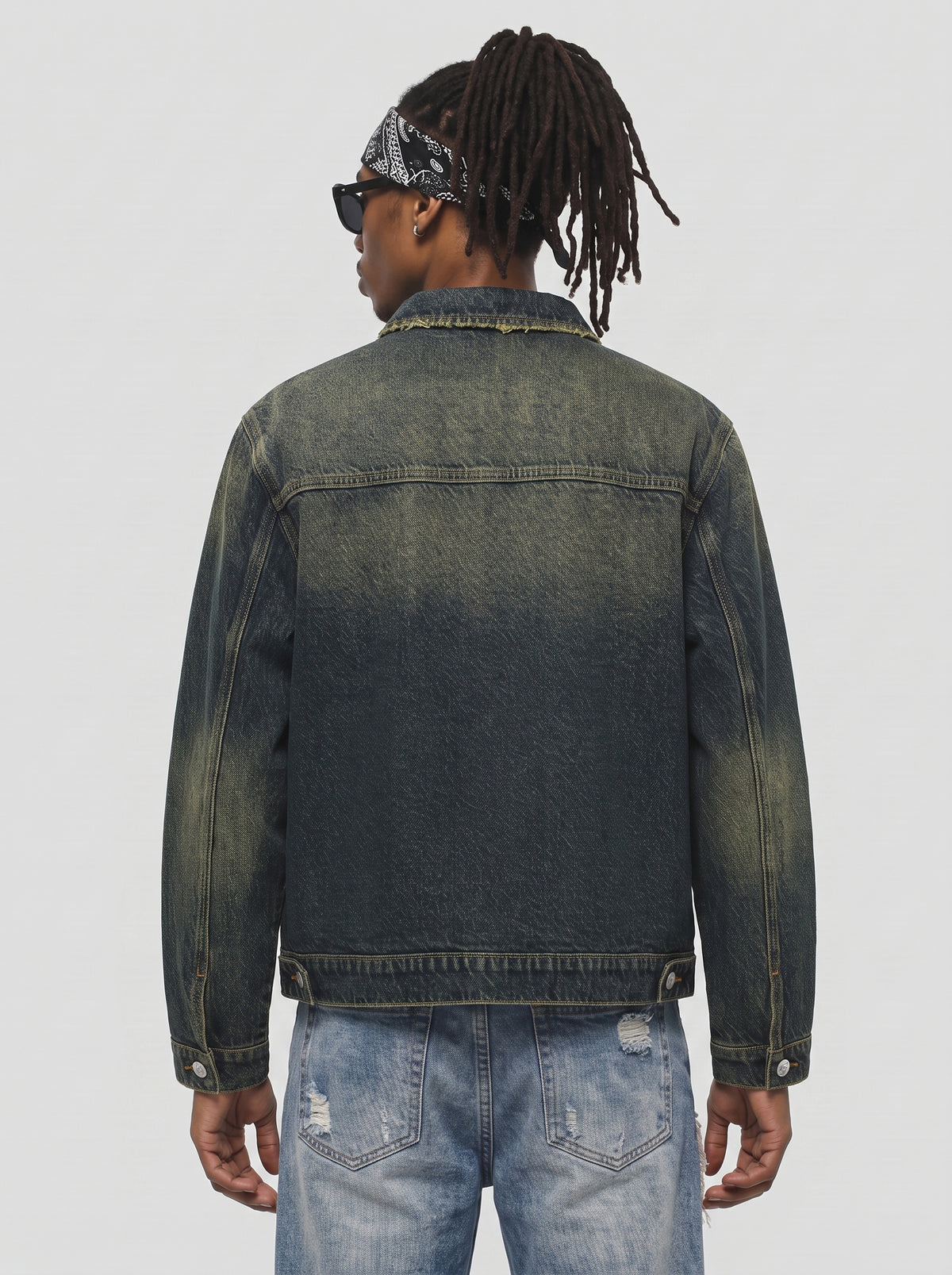 Model wearing B81 denim jacket in Vintage Indigo, back view