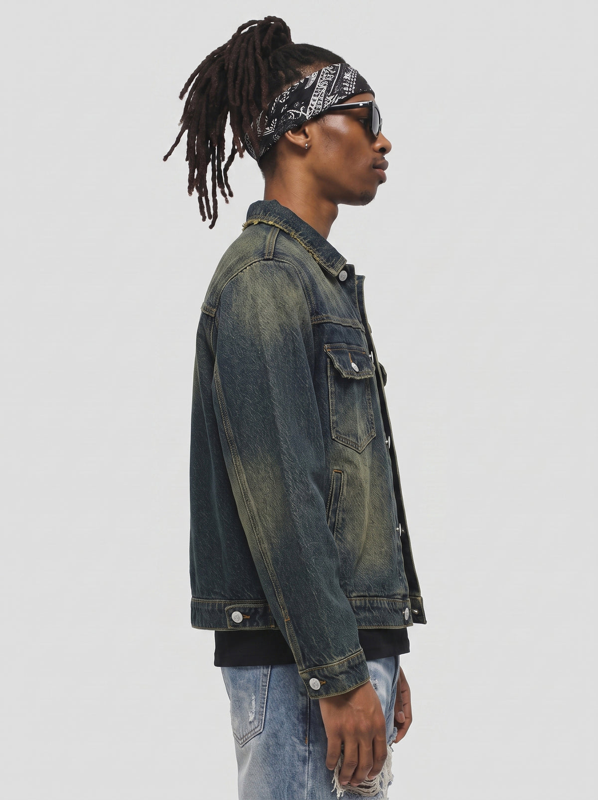 Model wearing B81 denim jacket in Vintage Indigo, side view