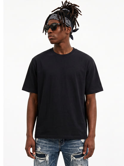 Model wearing US001 basic T-shirt in Black, front view