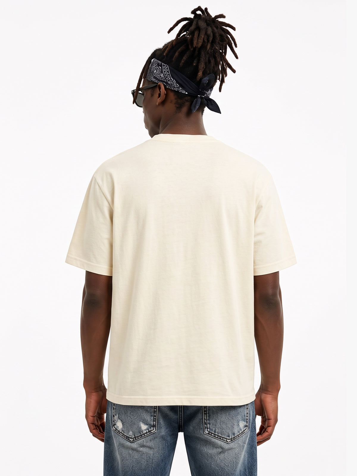 Model wearing US001 basic T-shirt in Apricot, back view