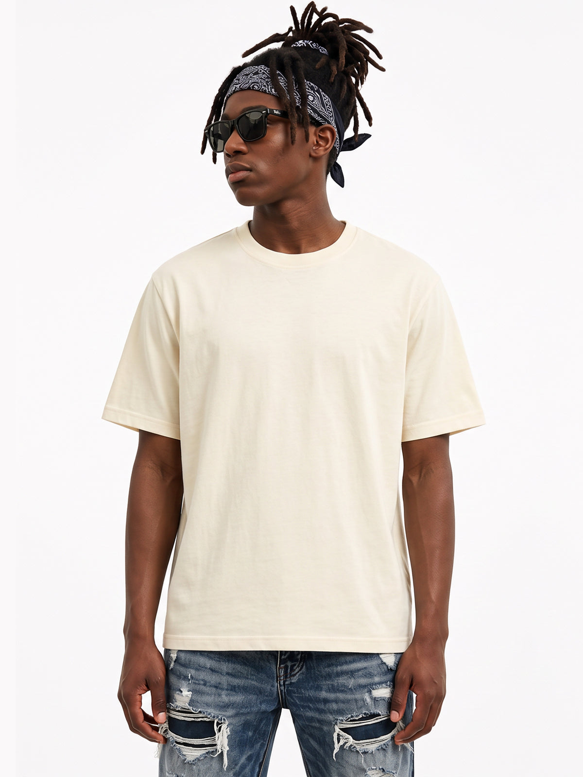 Model wearing US001 basic T-shirt in Apricot, front view