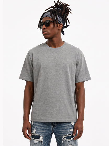 Model wearing US001 basic T-shirt in DarkGray, front view