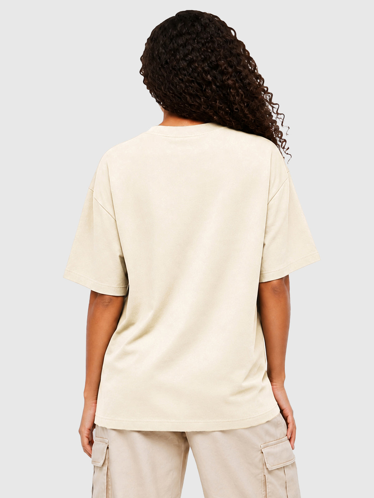 Model wearing C23011 crewneck T-shirt in Apricot, back view