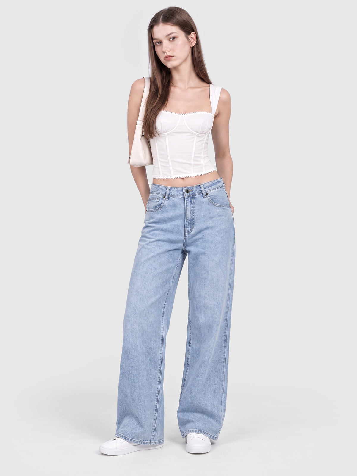 Model wearing JDP2512-15 women's wide-leg denim jeans in Light Blue, front view 1