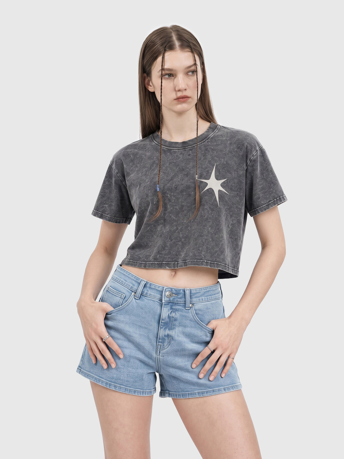 Model wearing RB20260303 women's high-rise denim shorts in Light Blue, front view 1