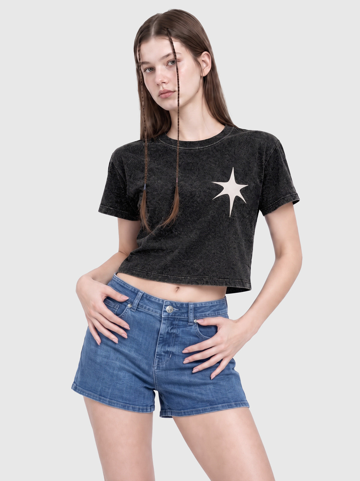 Model wearing RB20260303 women's high-rise denim shorts in Indigo, front view