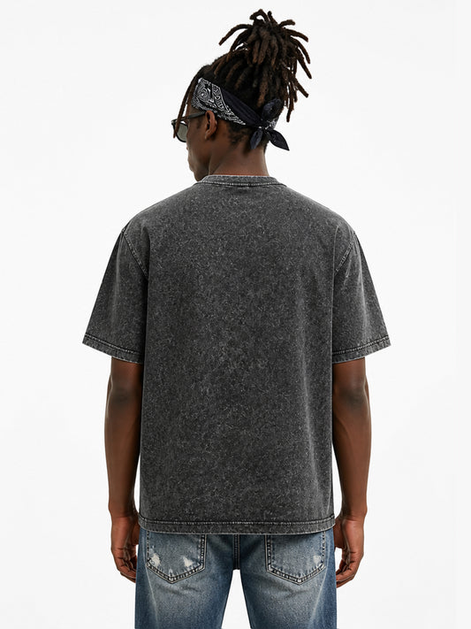 Model wearing US005 vintage washed T-shirt in Washed Black, back view